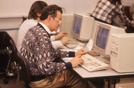 Photograph of adult learners working in a computer lab