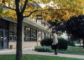 Photograph of faculty or staff entering Building A at Lakeshore campus