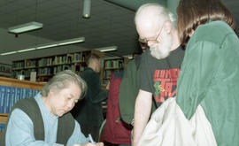 Photograph of Wayson signing books