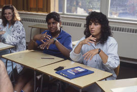 Photograph of students practicing sign language in class