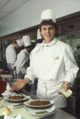 Photograph of students preparing food to serve in the Humber Room