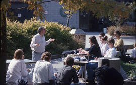 Photograph of an Instructor Giving a Class Outside