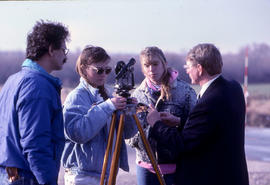 Photograph of Civil Engineering students and their professor working with equipment