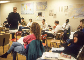 Photograph of Adrian Adamson in the classroom with students