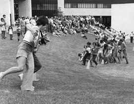 Photograph of Yvonne Kalverda Participating in a Three Legged Race During the Staff Picnic