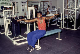 A photograph of athletes using fitness equipment