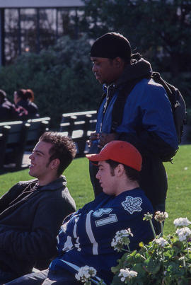 Photograph of students seated outside the Registration Centre