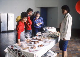 Photograph of Joanne Merigliano and Hyacinth James at a bake sale