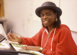 Photograph of a student sitting at a drafting table