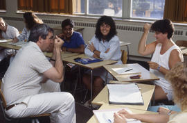 Photograph of students practicing sign language in class