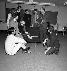 Photograph of the Theatre workshop instructor talking to his students