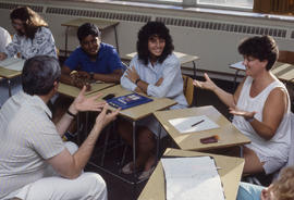 Photograph of students practicing sign language in class