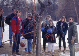 Photograph of a Landscaping Instructor Demonstrating Tree Pruning