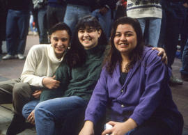Photograph of a group of students posing for the camera in the crowded student centre