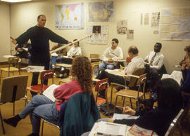 Photograph of faculty member Adrian Adamson teaching a class