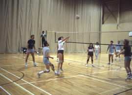 Photograph of a students and staff volleyball game in the Athletic Centre