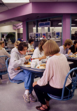 Photograph of People Eating in the Cafeteria