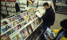 A photograph of students reading magazines in the Bookstore