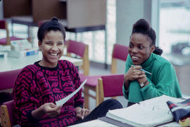 Photograph of students working on an assignment in the library